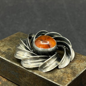 Modern silver brooch with amber