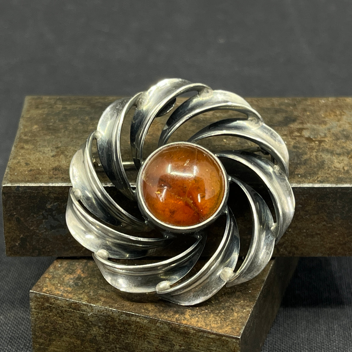 Modern silver brooch with amber