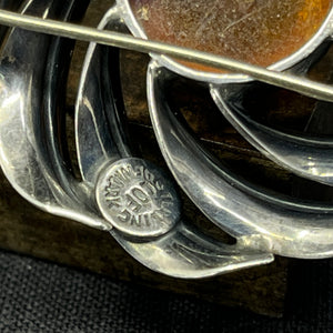 Modern silver brooch with amber