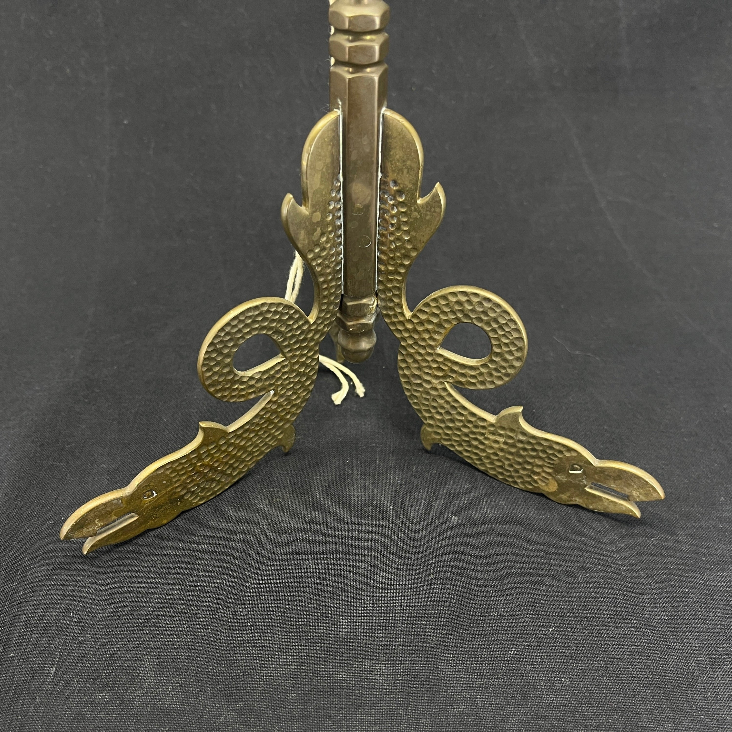 Tall brass flagpole with Midgard snakes