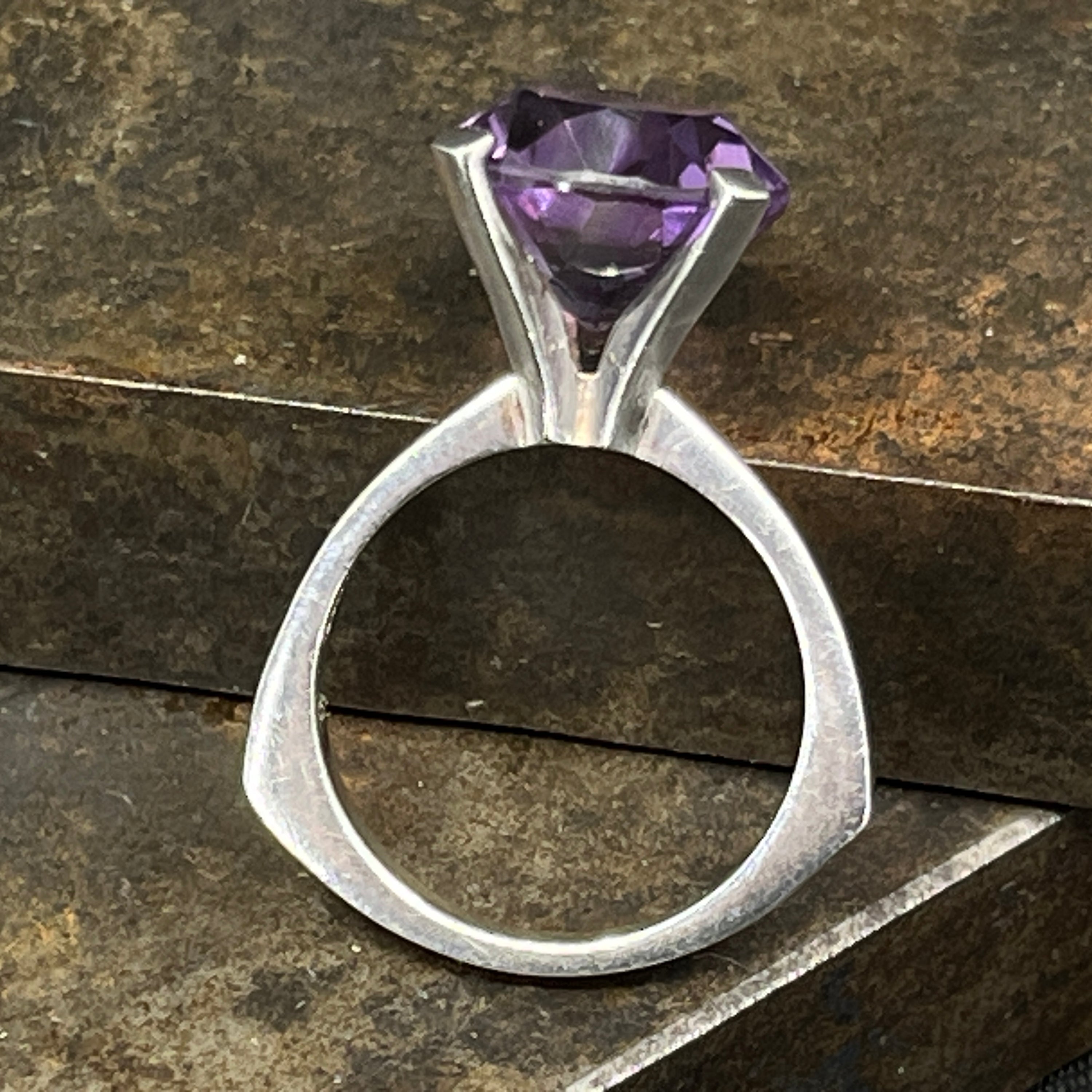 Modern ring with purple stone from NE From