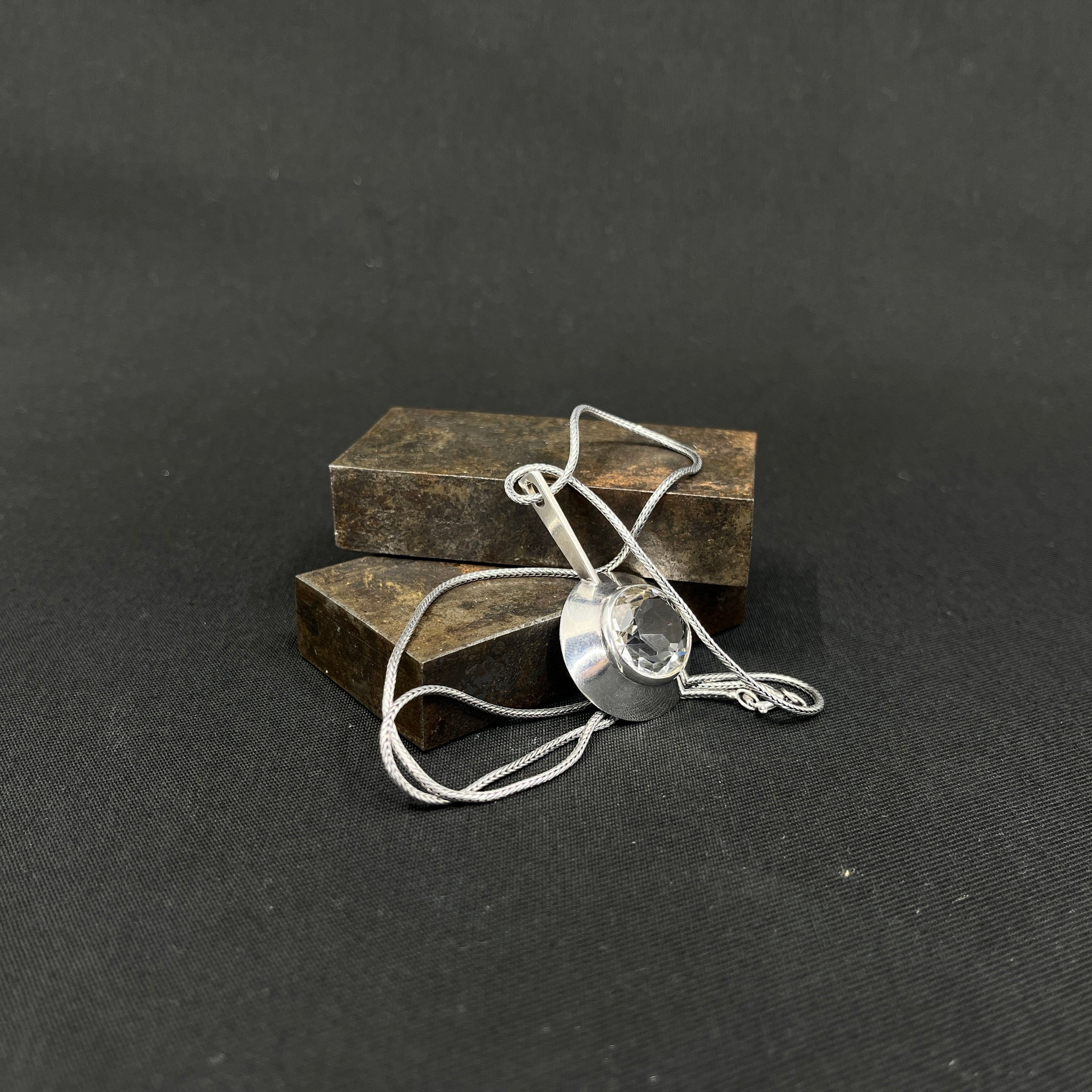 Modern pendant with cut clear stone