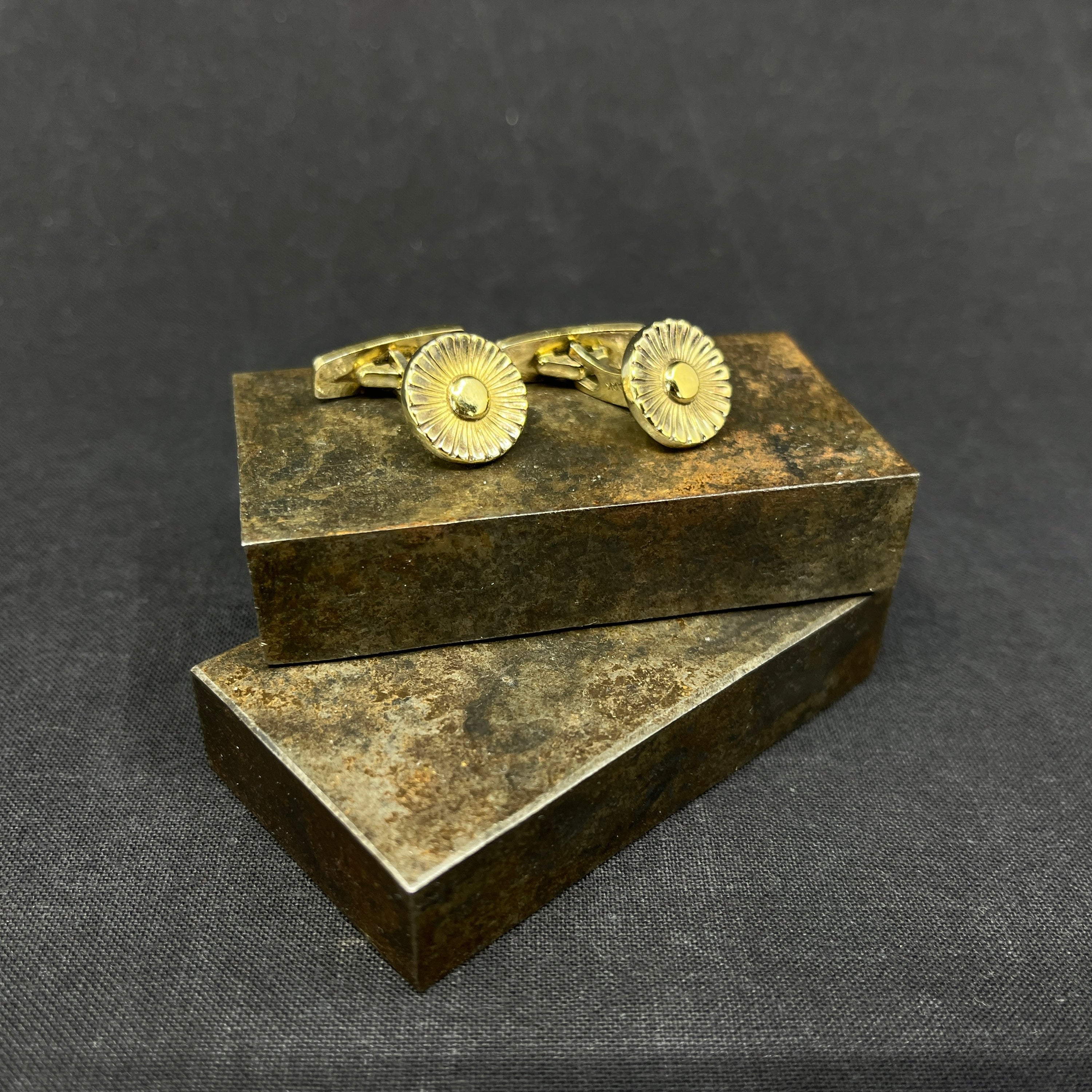 A pair of gilded cufflinks by Evald Nielsen
