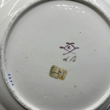 A pair of Sevres plates with scattered flowers