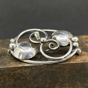 Broche i sølv - blomsterblade