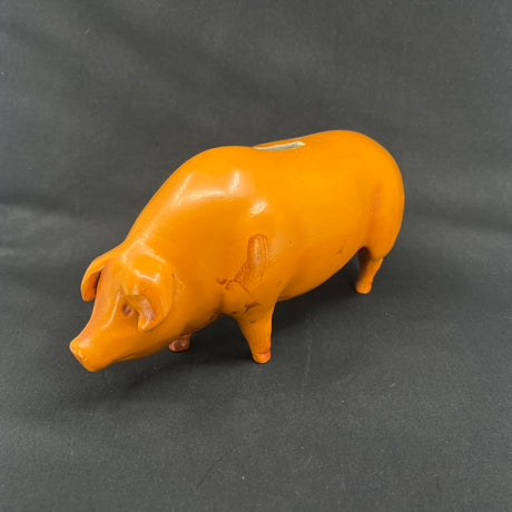 Red-orange piggy bank from the 1930s