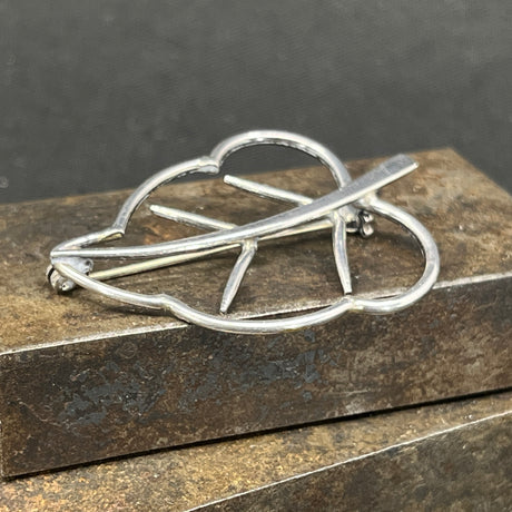 Modern silver brooch with amber