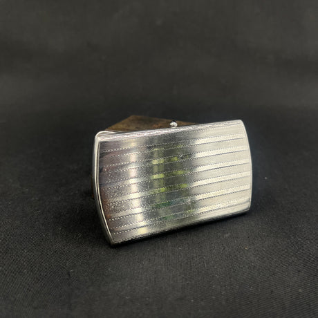 Case in silver with blue stone