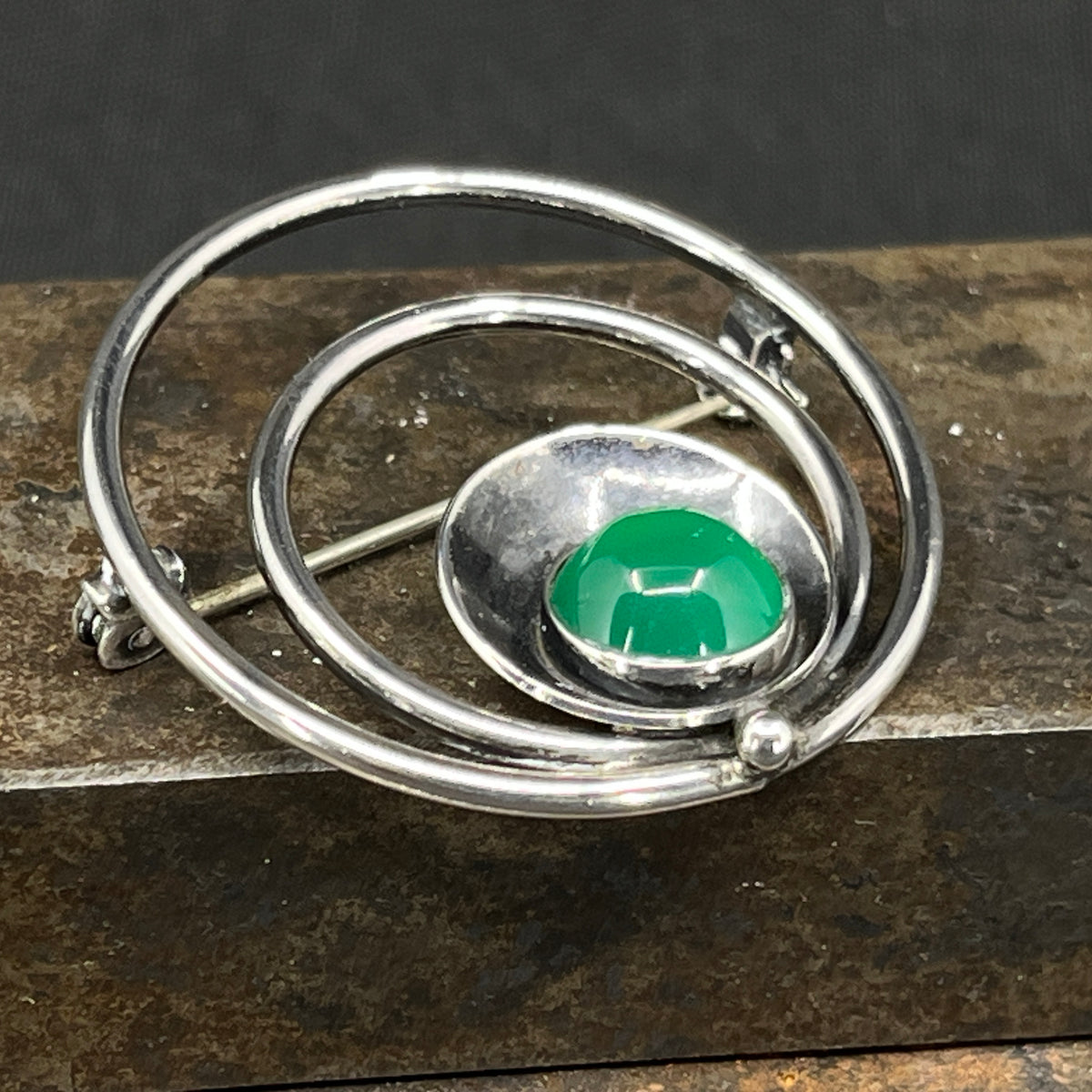Brooch with green stone by N E From