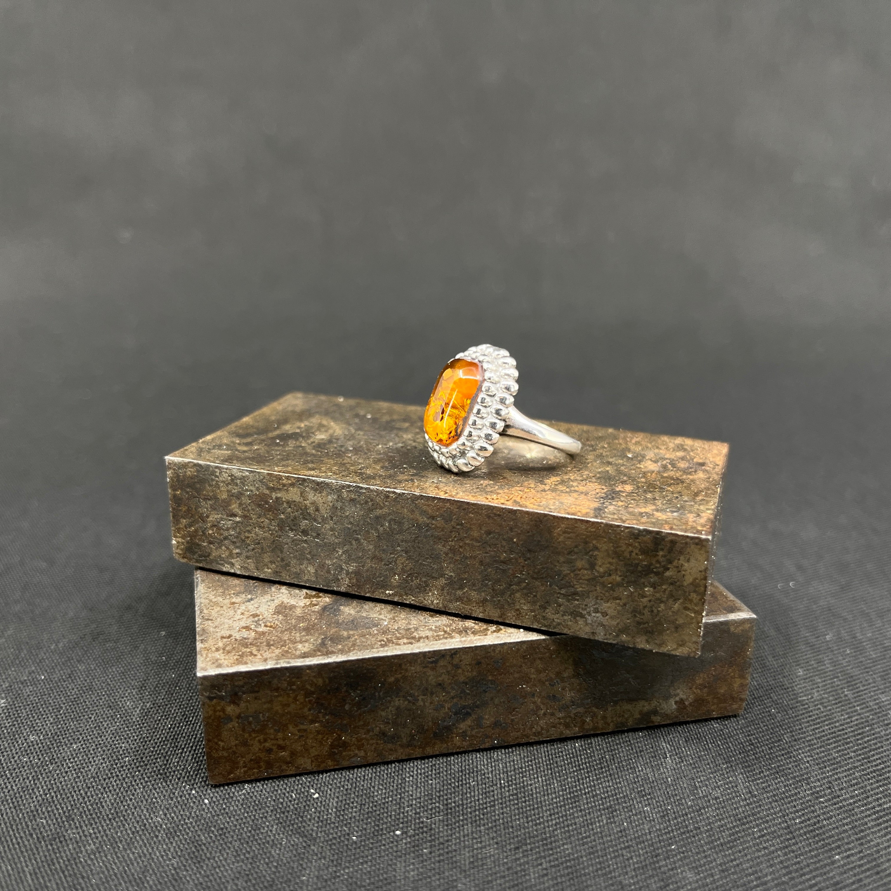 Ring with amber and silver pearls