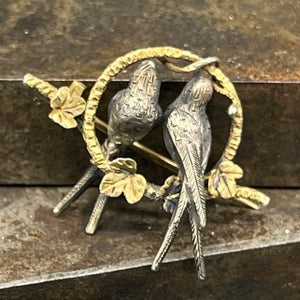 Gilded brooch with swallows from the late 19th century