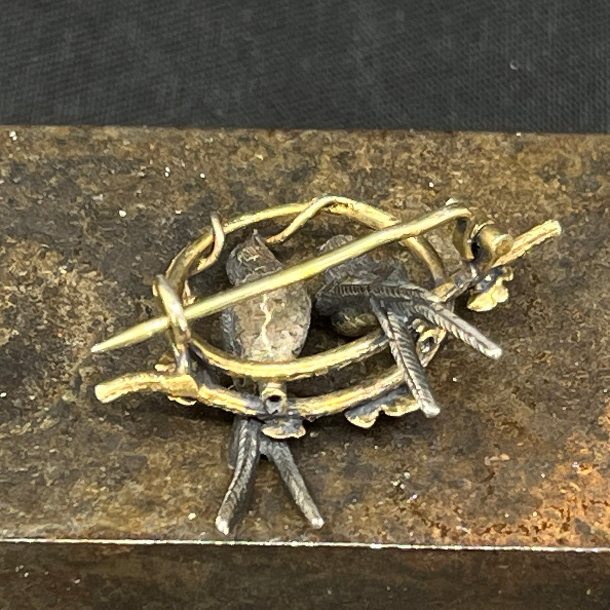 Gilded brooch with swallows from the late 19th century