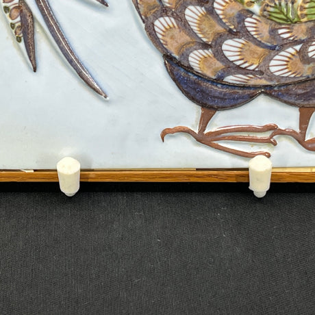 Aluminia relief in a wooden frame