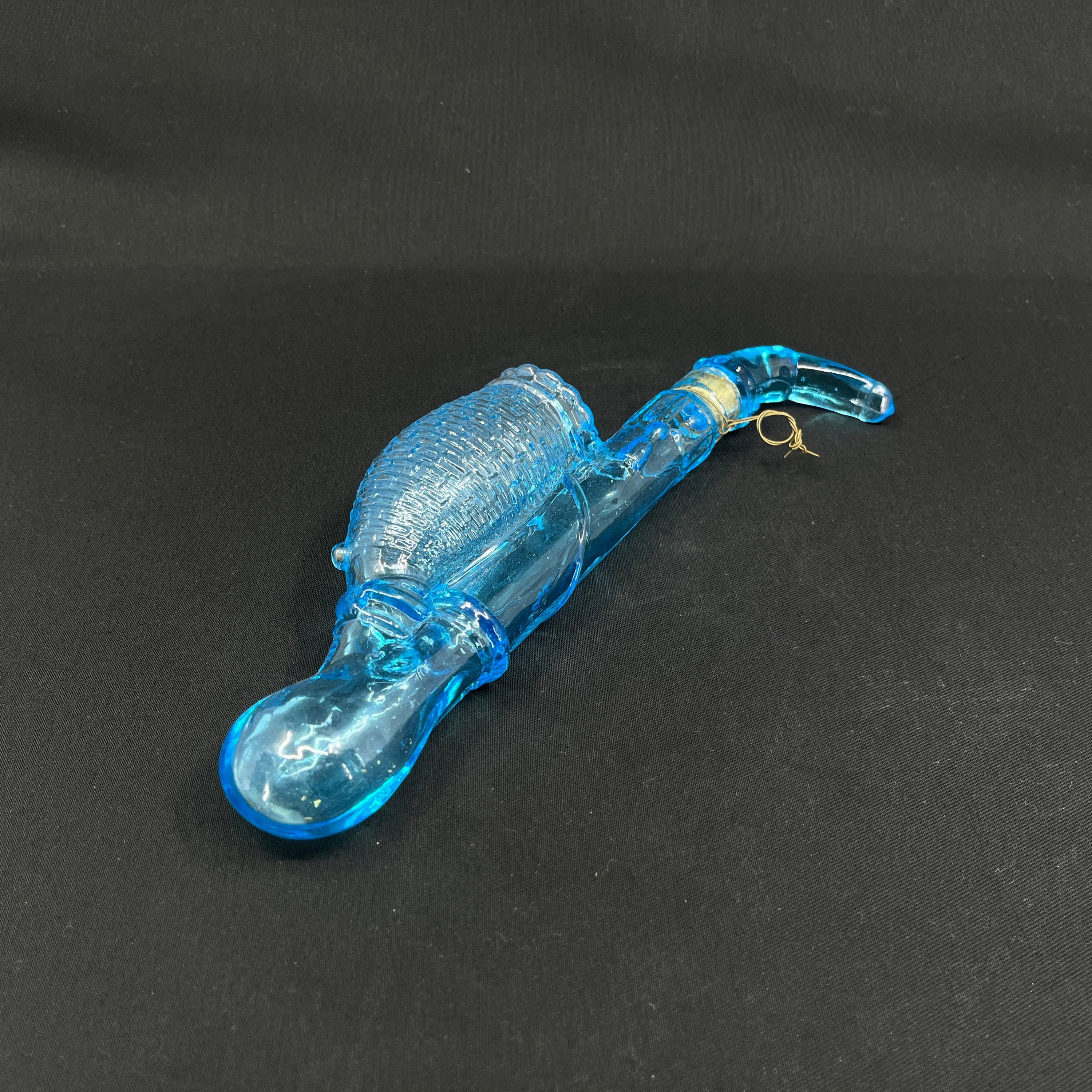 Light blue flask shaped like a long pipe
