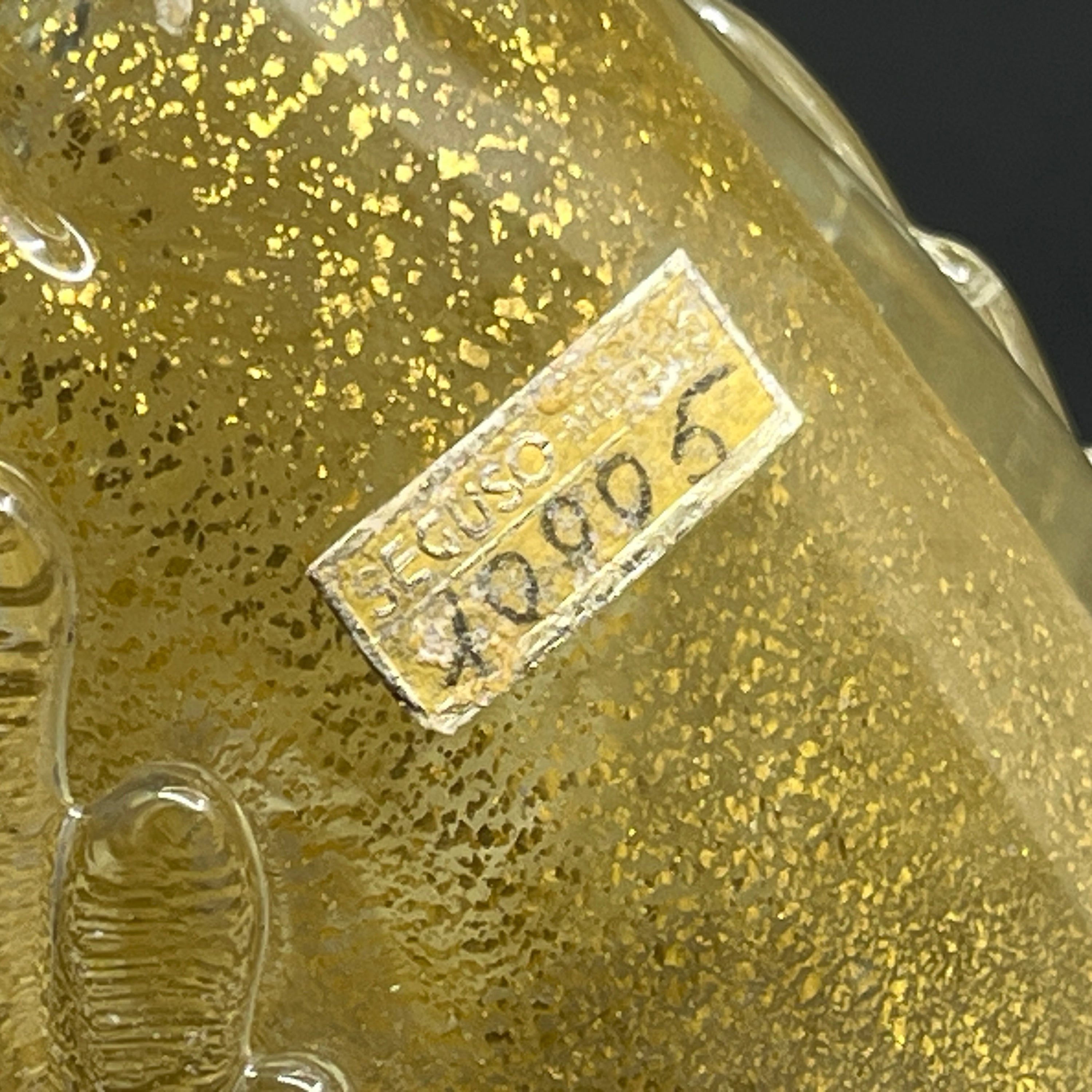 Et par Murano fugle med guld