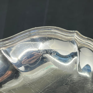 A pair of silver plated bottle trays