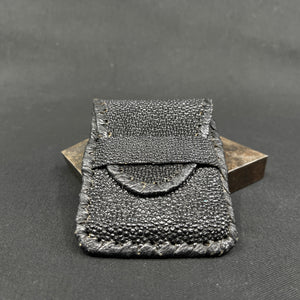 Black purse made of skin from a stingray