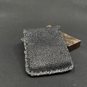 Black purse made of skin from a stingray