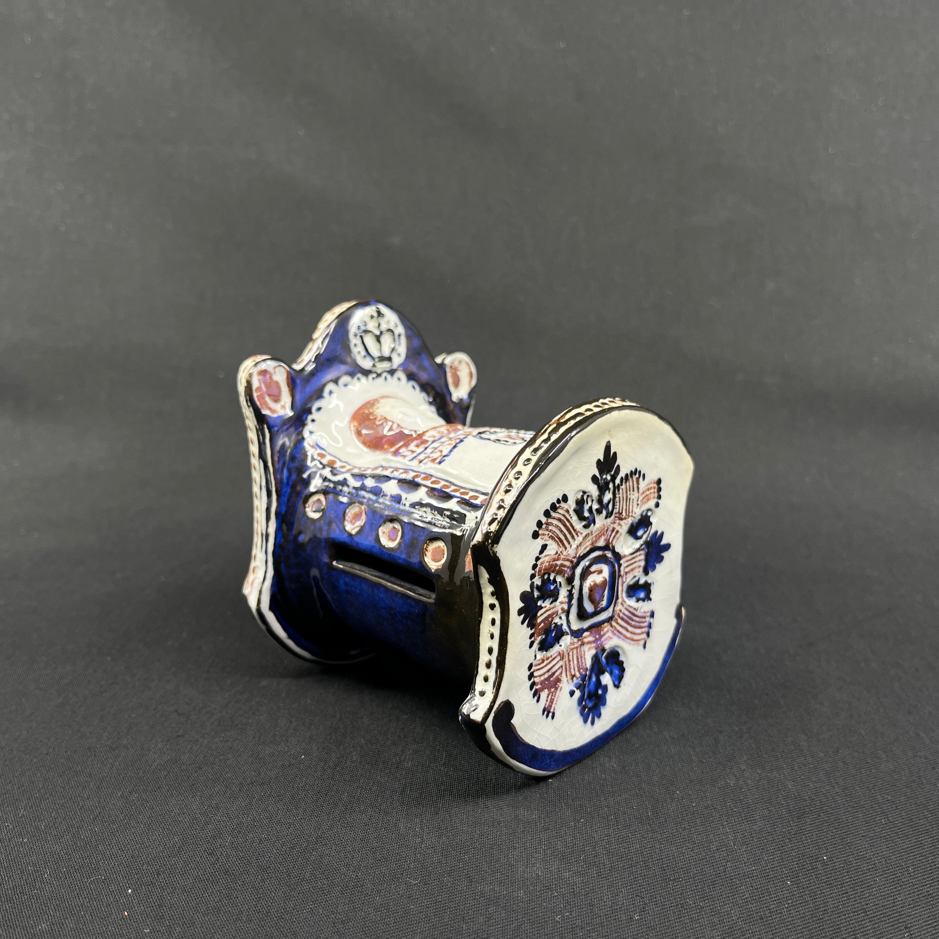 Rare Tenera piggy bank - child in cradle