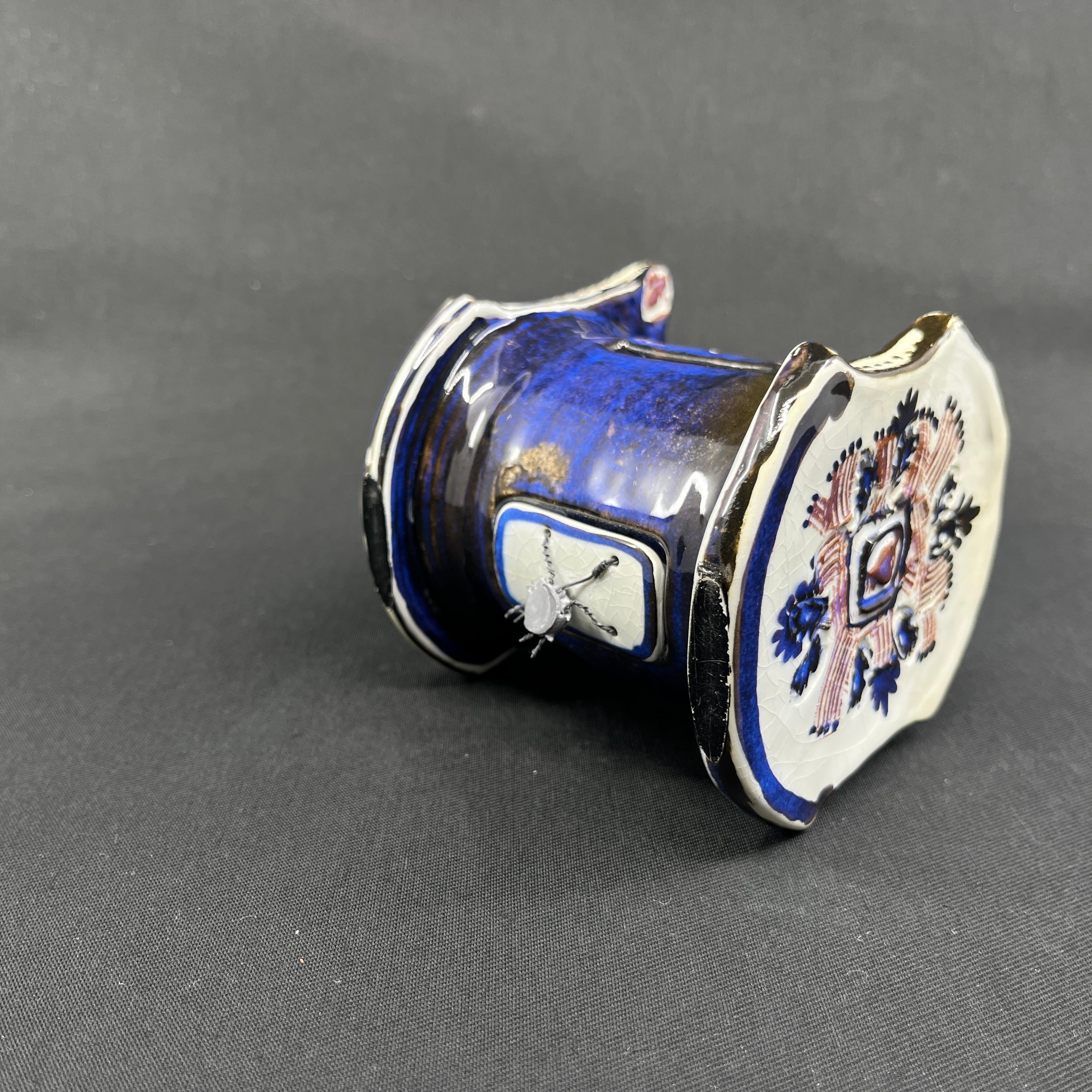 Rare Tenera piggy bank - child in cradle