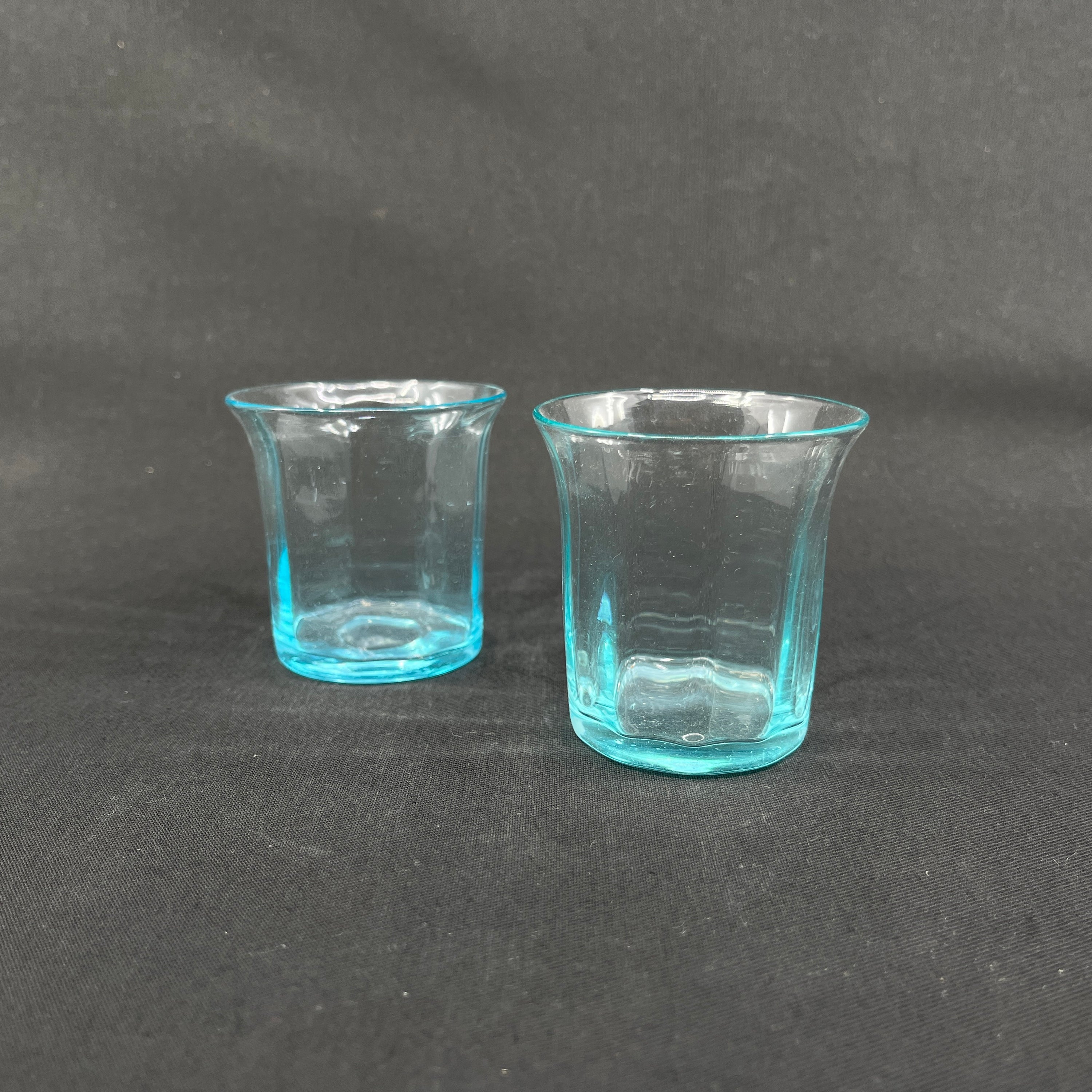 A pair of lake blue glasses with optics