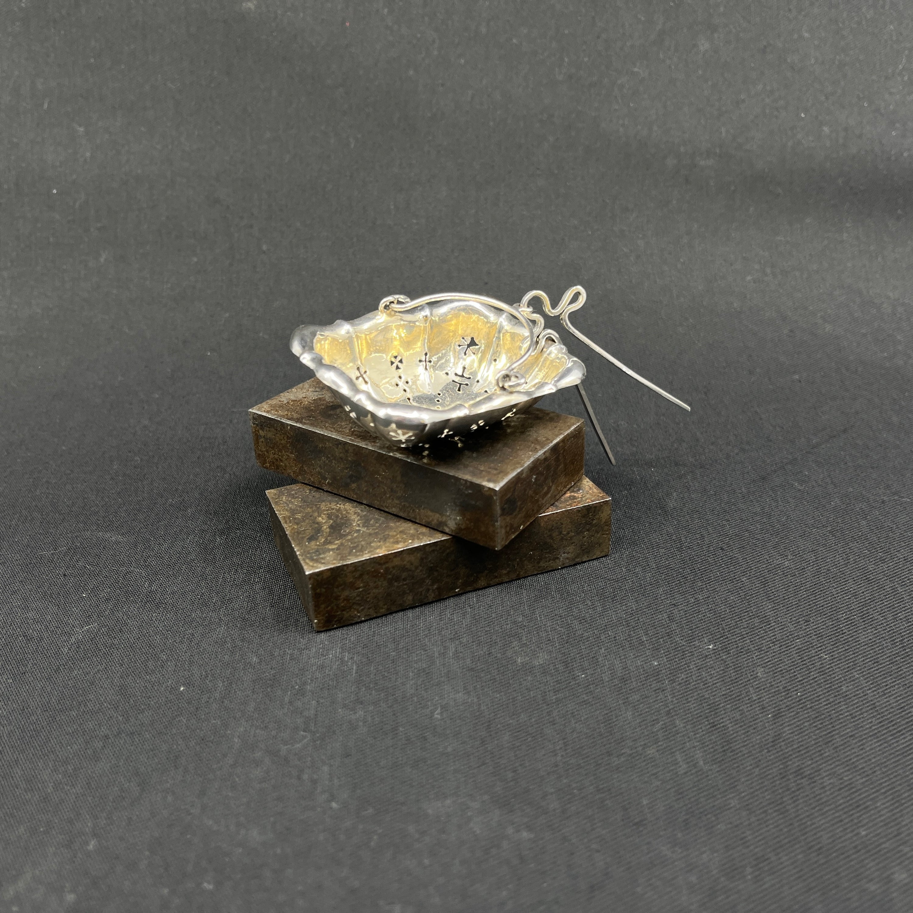 Antique round tea strainer in silver