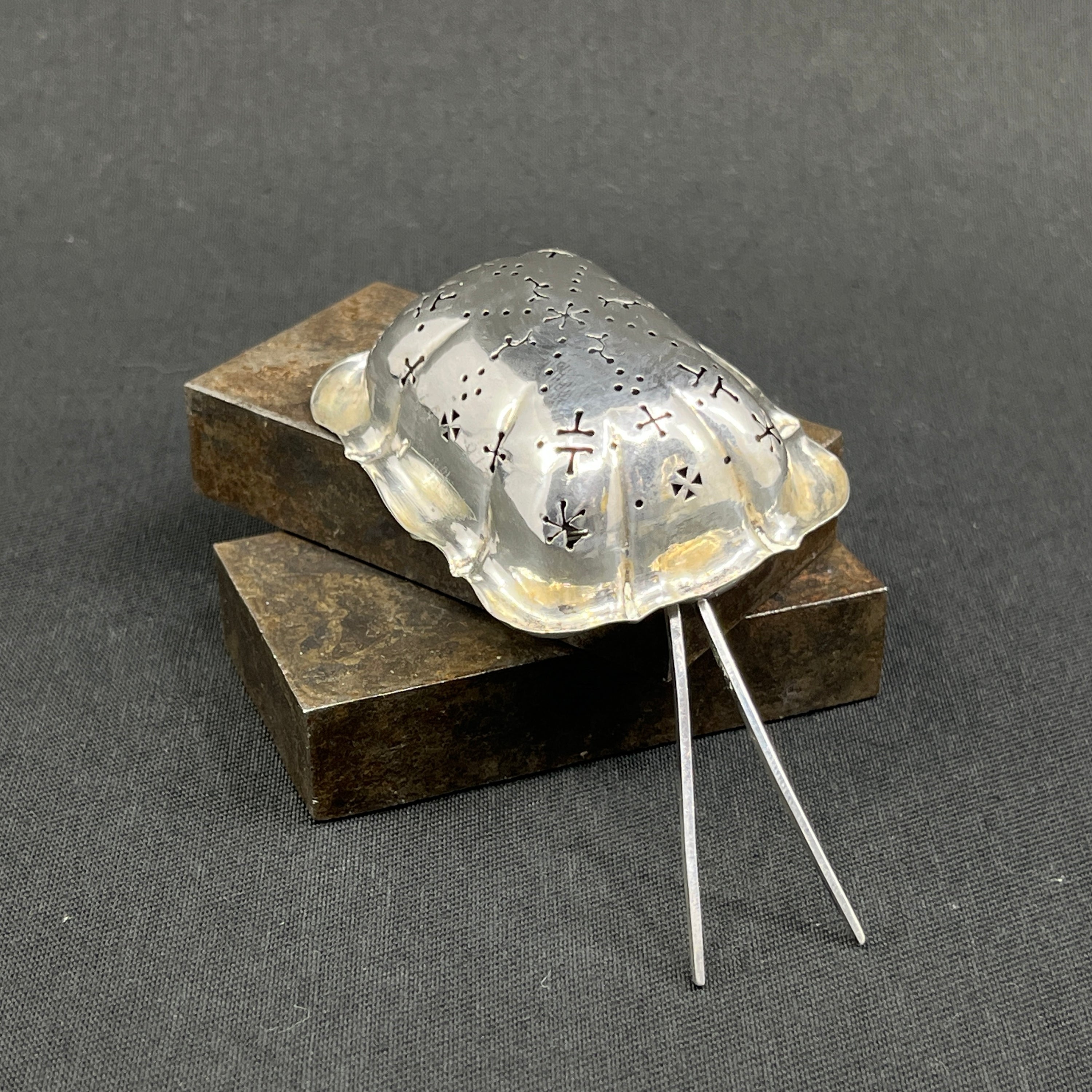 Antique round tea strainer in silver