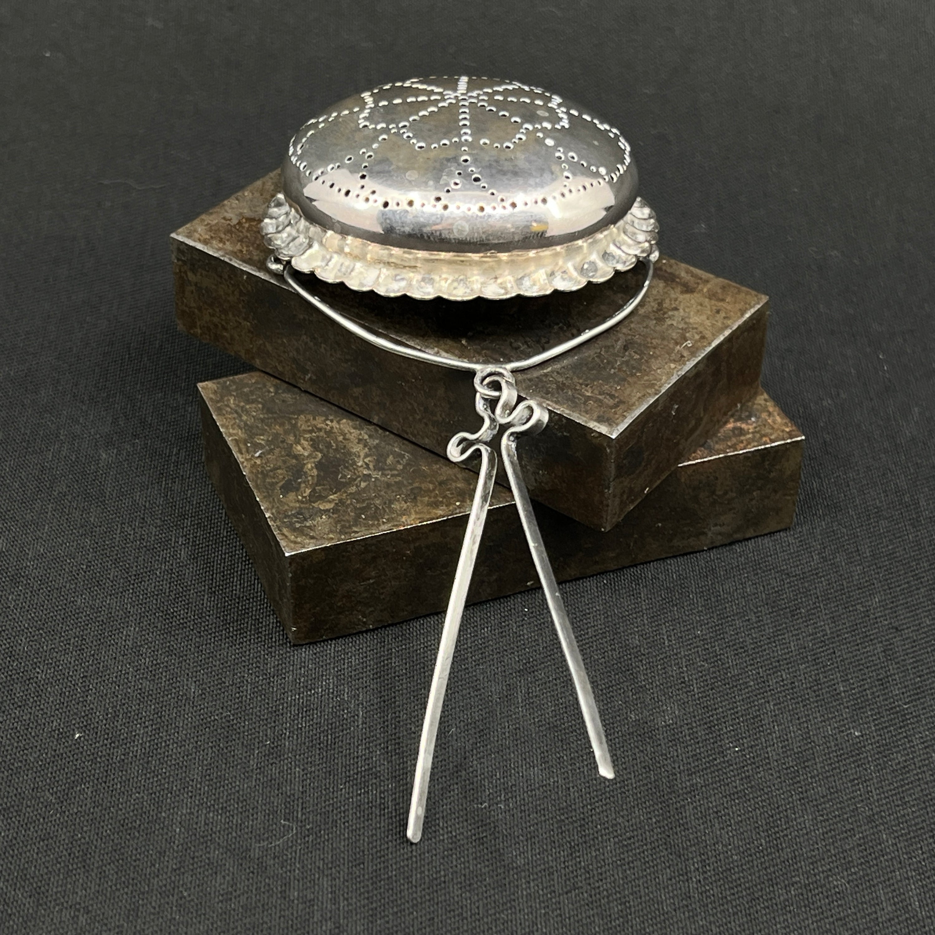 Antique round tea strainer in silver