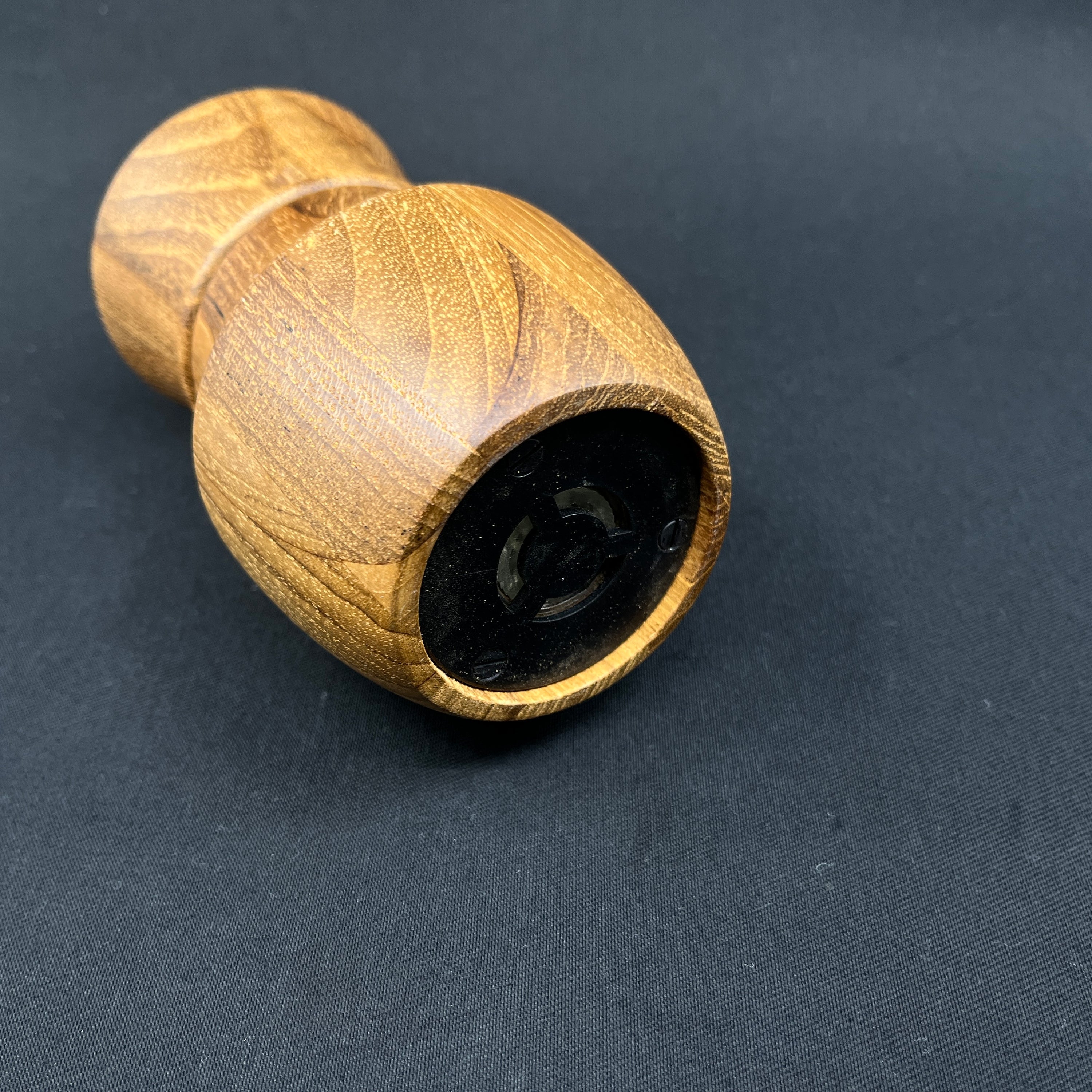 Modern pepper mill in teak