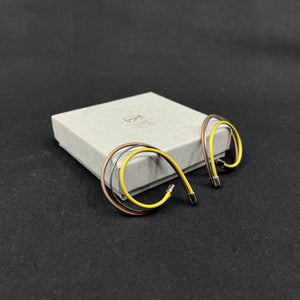 A pair of earrings by Kirsten Pontoppidan - yellow and brown