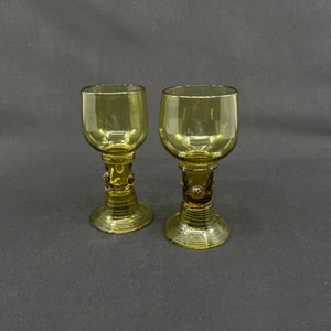 A pair of antique Röhmer glasses with hollow stems
