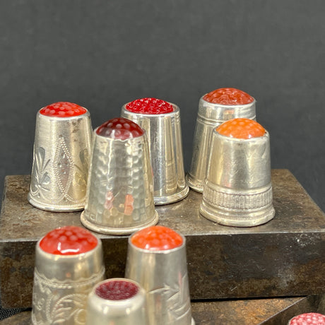 Silver thimble with stones - red shades