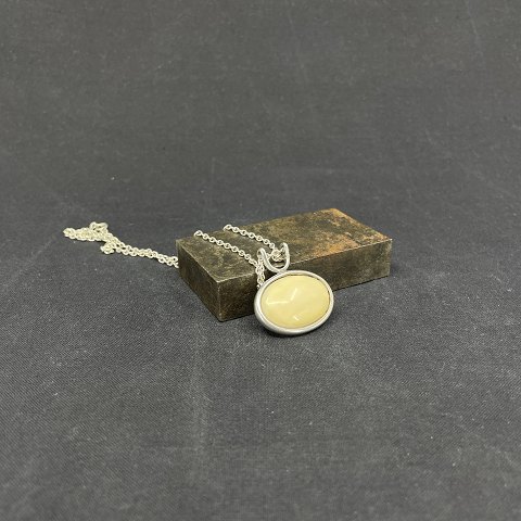 Pendant with ivory from N. E. From