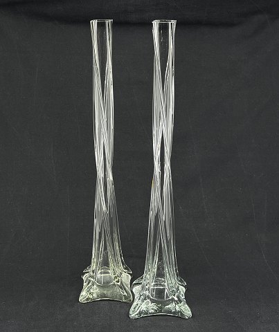 A pair of tall slender lily vases